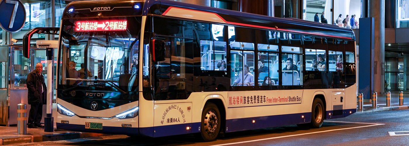 airport shuttle bus waiting outside a terminal