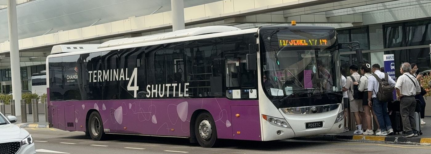 airport shuttle bus outside a terminal