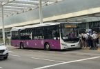 airport shuttle bus outside a terminal