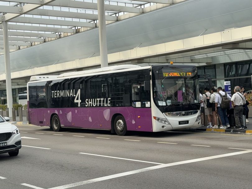 airport shuttle bus outside a terminal