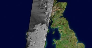A communications satellite orbiting above Earth